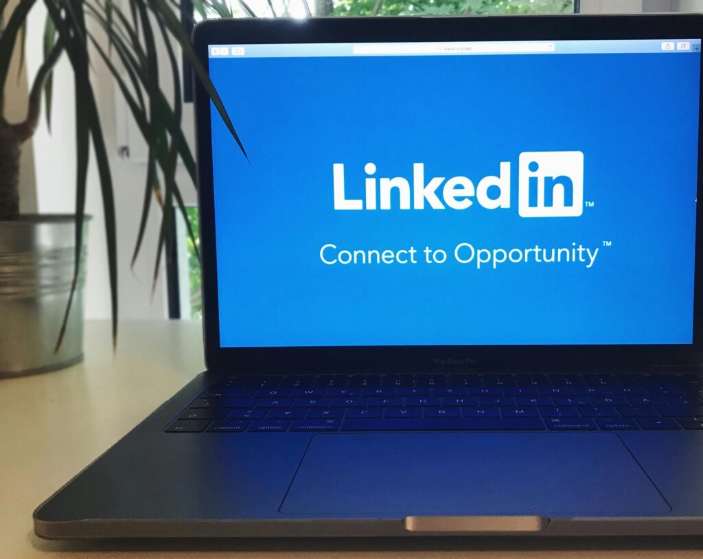 A computer with LinkedIn showing on the screen.