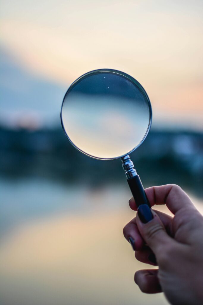 A magifying glass to represent taking a closer look at things (for research).